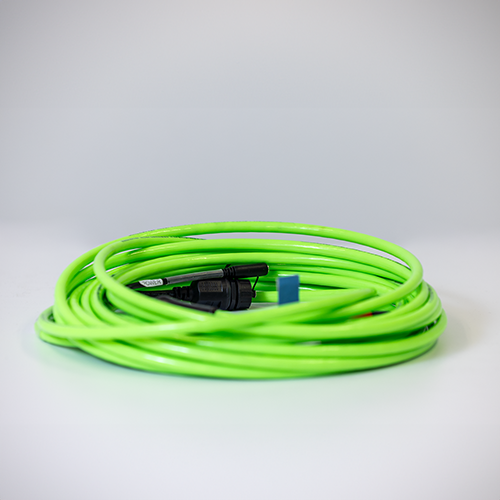 Coiled green subsea cable with a multi-pin underwater connector, used for power, Ethernet, and sensor integration with Subnero modems